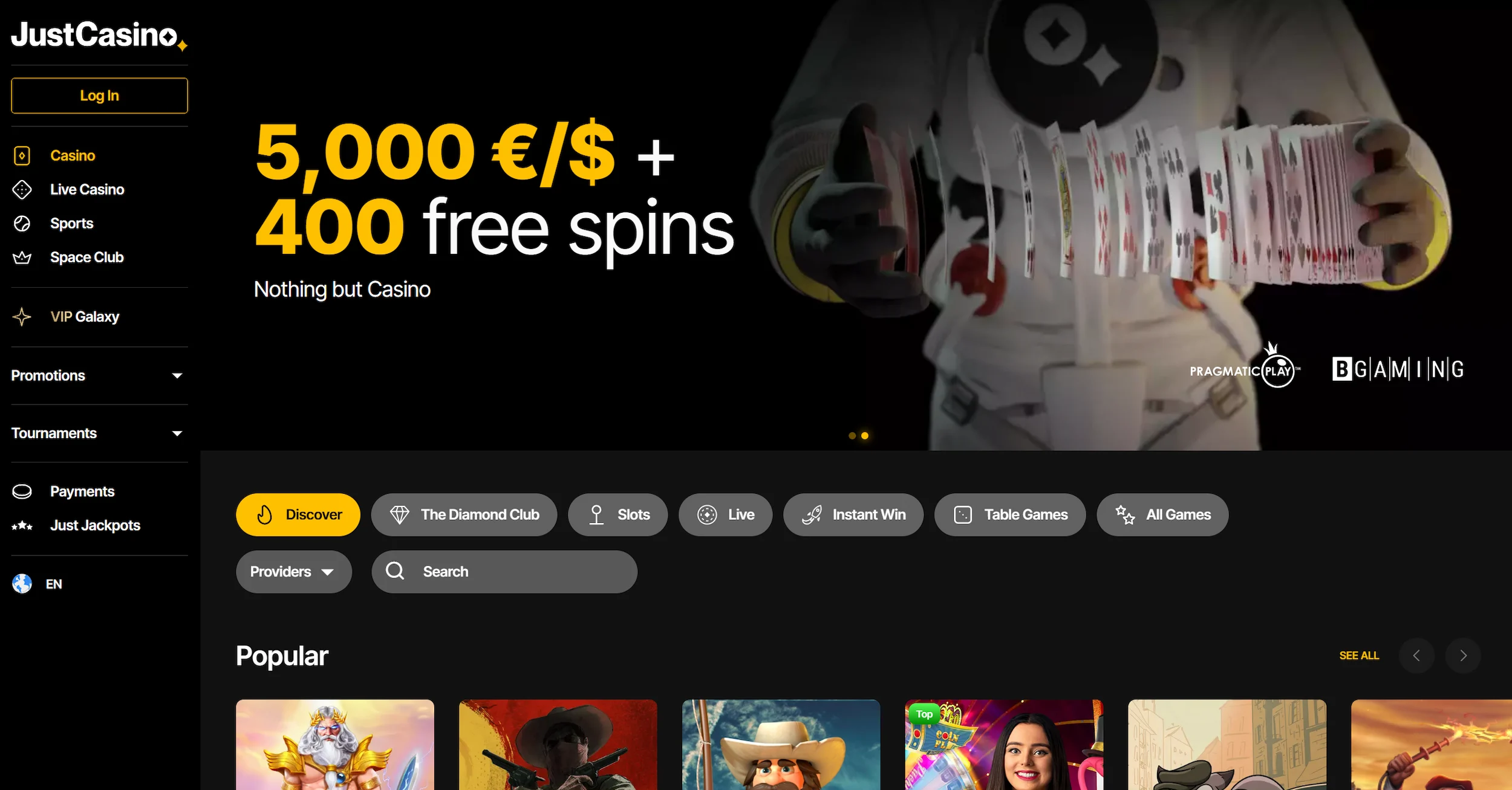 JustCasino frontpage showing welcome bonus offer, online pokies selection and site navigation